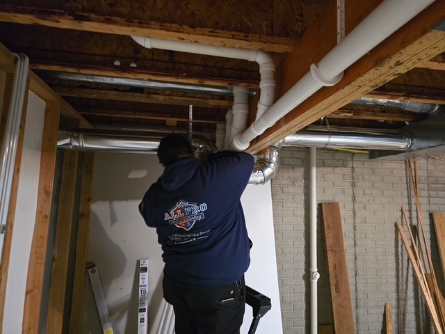 Hanging spiral ductwork inside a commercial chase